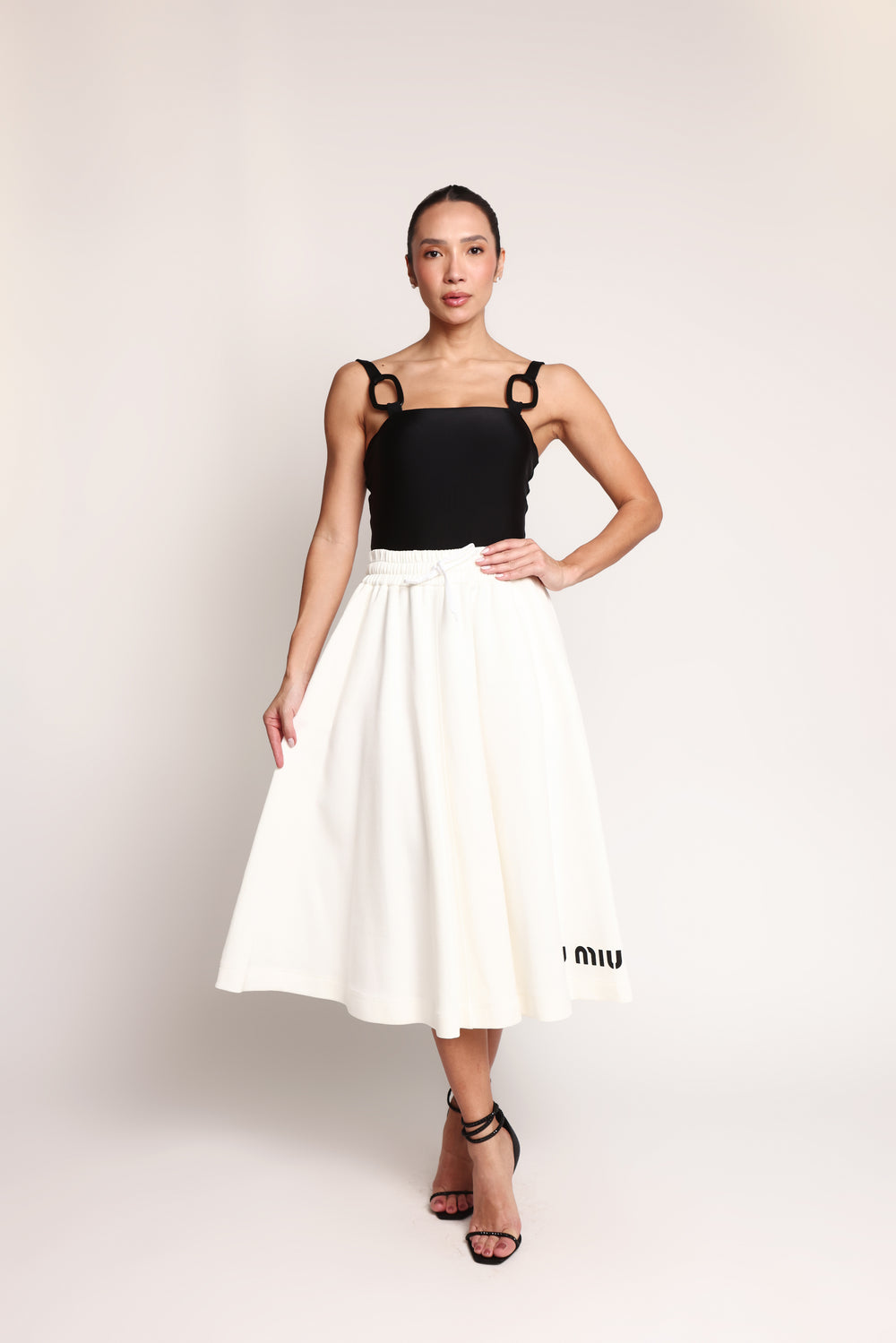 Saia midi Miu Miu